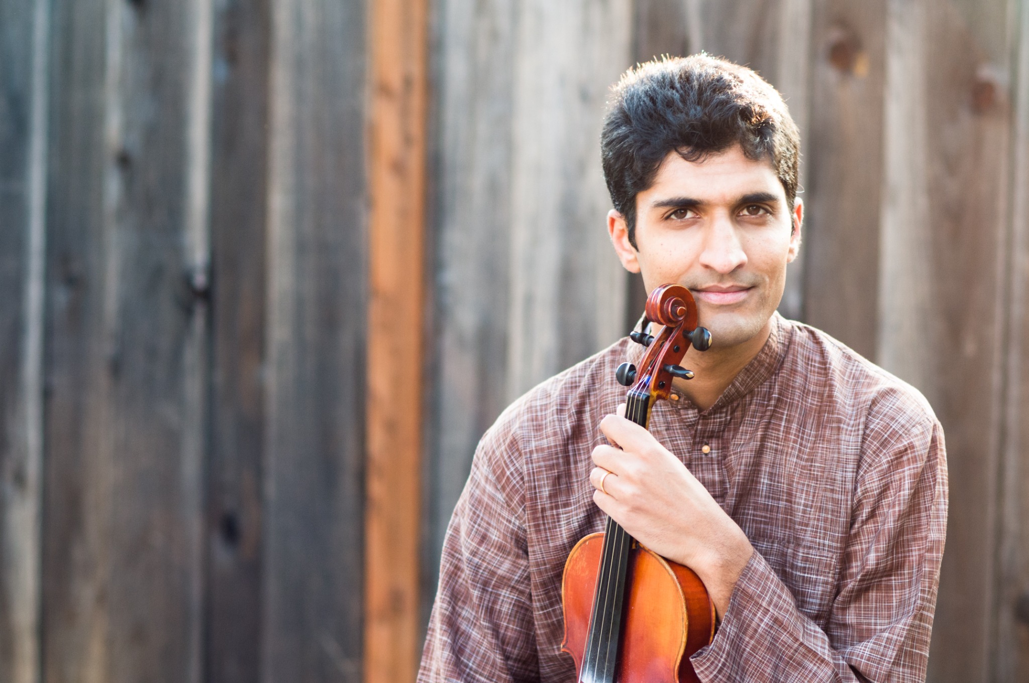 Krishna Parthasarathy holding a violin