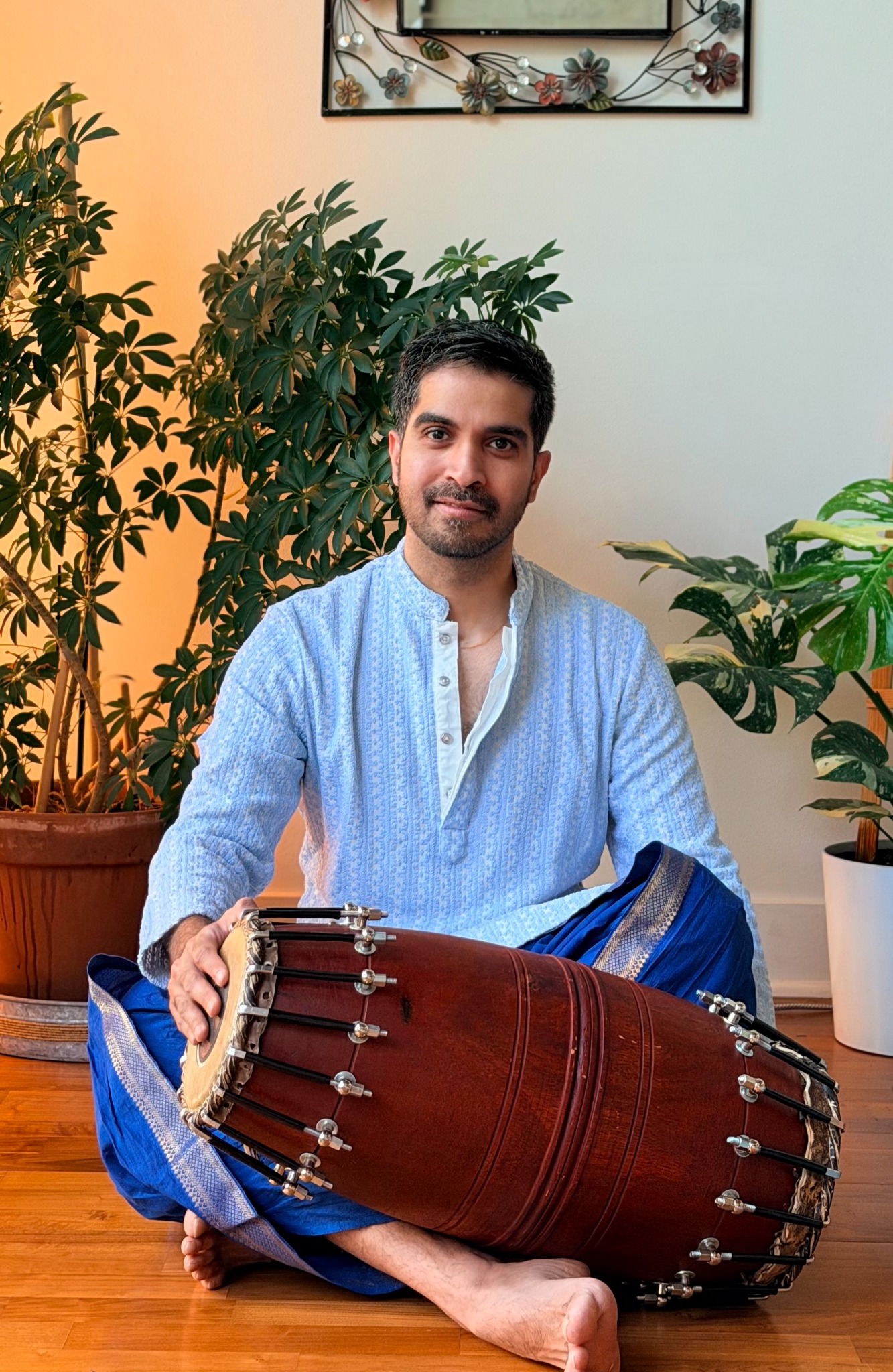 Varun Pattabhiraman seated with a mridangam